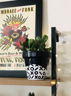 My "X's & O's" hand painted terracotta planter is one of my all time favorites. I love the simplicity of the black and white pattern. This one is for the classy gals who like to keep it neutral!