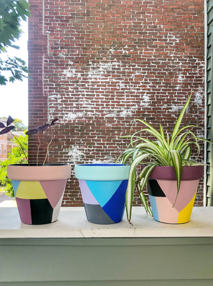 The Blank Canvas Company's hand painted "Blue & Gray Geometric" terracotta planter is a mix of modern chic + funky fresh. These cool tones will bring a sense of calm to your space.