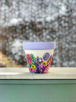 My “Wildflower" hand painted terracotta planter illustrates some of my favorite funky fresh flowers in non-traditional colors.