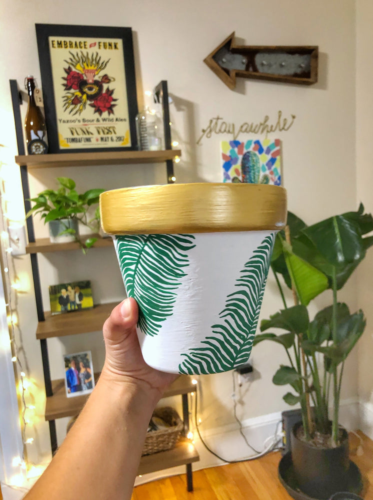 
                
                    Load image into Gallery viewer, My &amp;quot;Gold Leaf&amp;quot; hand painted terracotta planter is my classiest planter! The gold trim and geometric detail makes this palm planter extra feminine.
                
            