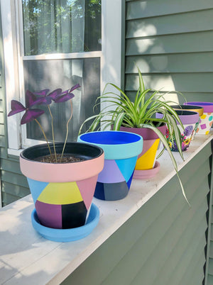 The Blank Canvas Company's hand painted "Blue & Gray Geometric" terracotta planter is a mix of modern chic + funky fresh. These cool tones will bring a sense of calm to your space.
