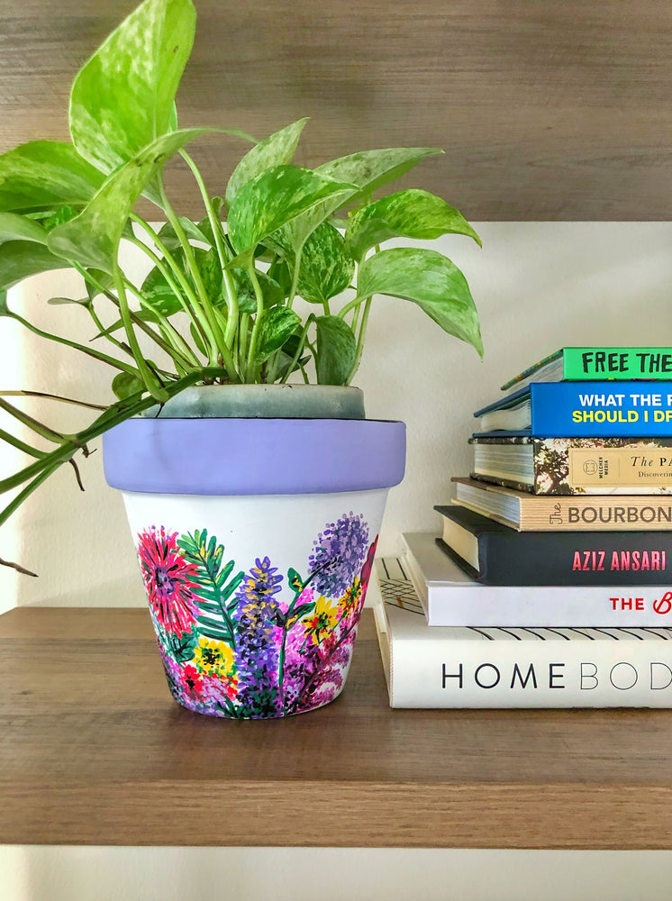 My “Wildflower" hand painted terracotta planter illustrates some of my favorite funky fresh flowers in non-traditional colors.