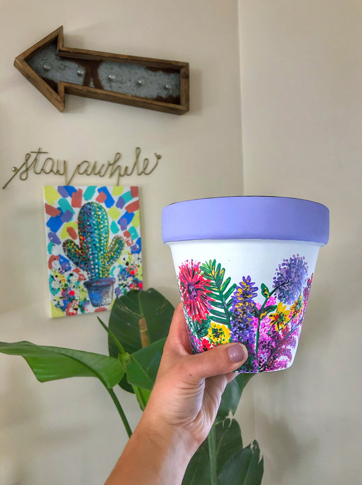 
                
                    Load image into Gallery viewer, My “Wildflower&amp;quot; hand painted terracotta planter illustrates some of my favorite funky fresh flowers in non-traditional colors.
                
            