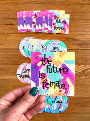 The “Future Is Female” 3"x3" square sticker is a daily reminder to gals of all ages that women are strong, smart and powerful. Who run the world? GIRLS. Stick it onto your laptop, notebook or Yeti cooler!