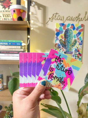 The “Future Is Female” 3"x3" square sticker is a daily reminder to gals of all ages that women are strong, smart and powerful. Who run the world? GIRLS. Stick it onto your laptop, notebook or Yeti cooler!